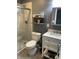 Modern bathroom with a glass-enclosed shower, updated vanity, and stylish fixtures at 52 S 16Th Ave, Beech Grove, IN 46107
