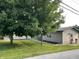 Exterior angle shot of home, showcasing manicured lawn and curb appeal at 52 S 16Th Ave, Beech Grove, IN 46107