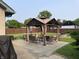 Backyard gazebo set on stone pavers with seating, tables, and open views at 52 S 16Th Ave, Beech Grove, IN 46107