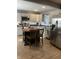 Stylish kitchen with stainless steel appliances, gray cabinets, and a functional center island at 52 S 16Th Ave, Beech Grove, IN 46107