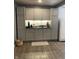 Updated kitchen with ample storage, granite counters, and modern stainless appliances at 52 S 16Th Ave, Beech Grove, IN 46107