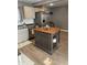 Well-appointed kitchen featuring an island with seating, stainless appliances, and modern finishes at 52 S 16Th Ave, Beech Grove, IN 46107