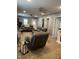 Open-concept living room with neutral tones, ceiling fans, and multiple entryways for easy flow at 52 S 16Th Ave, Beech Grove, IN 46107