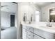 Bright bathroom with a double vanity, light gray cabinets, and modern fixtures at 5425 N Delaware St, Indianapolis, IN 46220