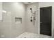 Walk-in shower featuring mosaic tile and sleek fixtures at 5425 N Delaware St, Indianapolis, IN 46220