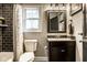 Bathroom featuring tiled shower, vanity with countertop and dark accents at 5425 N Delaware St, Indianapolis, IN 46220