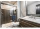 Bathroom featuring tile shower, vanity with countertop and mirror at 5425 N Delaware St, Indianapolis, IN 46220
