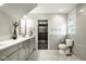 A luxurious bathroom offers a double vanity and a walk in closet at 5425 N Delaware St, Indianapolis, IN 46220