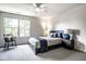 Cozy bedroom with carpet, window and bedside table at 5425 N Delaware St, Indianapolis, IN 46220