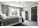Bedroom with overhead lighting and a window at 5425 N Delaware St, Indianapolis, IN 46220