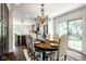 A dining room with a chandelier sits adjacent to a beautifully appointed kitchen at 5425 N Delaware St, Indianapolis, IN 46220