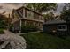 Exterior view showing a well-maintained yard and a modern outdoor grill and private garage at 5425 N Delaware St, Indianapolis, IN 46220