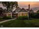 Inviting two-story home featuring an attractive lawn, landscaping, and covered entry at 5425 N Delaware St, Indianapolis, IN 46220