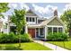 Charming two-story home featuring a well-maintained lawn, inviting walkway, and covered entry at 5425 N Delaware St, Indianapolis, IN 46220