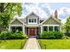 Attractive two-story home featuring a well-maintained lawn, walkway, and covered entry at 5425 N Delaware St, Indianapolis, IN 46220