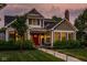 Charming two-story home with a red front door, well-manicured lawn, and inviting walkway at 5425 N Delaware St, Indianapolis, IN 46220