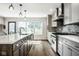 A stunning kitchen offers modern appliances, an island and lots of light at 5425 N Delaware St, Indianapolis, IN 46220