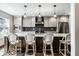 Beautiful kitchen island with white countertop and pendant lighting at 5425 N Delaware St, Indianapolis, IN 46220
