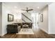 Cozy living room featuring hardwood floors, neutral decor, and staircase at 5425 N Delaware St, Indianapolis, IN 46220