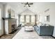 Bright and spacious living room featuring a vaulted ceiling, fireplace, and plenty of natural light at 5425 N Delaware St, Indianapolis, IN 46220