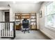 Office featuring a desk and wall shelving at 5425 N Delaware St, Indianapolis, IN 46220