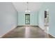 The light and bright dining area features modern light fixture, wood-look floors, and neutral walls at 5847 Democracy Dr, Indianapolis, IN 46254