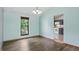 Bright dining room with hardwood floors and a view into the kitchen at 5847 Democracy Dr, Indianapolis, IN 46254