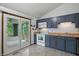 Kitchen with updated cabinets, modern appliances, and access to a screened in patio at 5847 Democracy Dr, Indianapolis, IN 46254