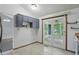 Bright breakfast nook area with access to the back screened-in porch at 5847 Democracy Dr, Indianapolis, IN 46254