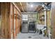 Unfinished laundry room with updated washer and dryer and utilitarian sink, perfect for easy chore completion at 5847 Democracy Dr, Indianapolis, IN 46254