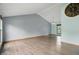 Spacious living room features hardwood floors, and neutral walls, with high ceilings and large window at 5847 Democracy Dr, Indianapolis, IN 46254