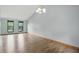 Spacious living room with hardwood floors, neutral paint, and ample natural light at 5847 Democracy Dr, Indianapolis, IN 46254