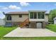 The backyard patio features a screened-in porch and offers ample space for outdoor furniture at 5847 Democracy Dr, Indianapolis, IN 46254