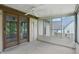 Relaxing sunroom featuring a ceiling fan and large windows to allow for outside views at 5847 Democracy Dr, Indianapolis, IN 46254