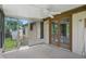 Inviting sunroom with ceiling fan and large sliding windows and doors to outside at 5847 Democracy Dr, Indianapolis, IN 46254