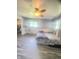 Bright bedroom featuring hard surface floors and a ceiling fan at 623 Chariot Ln, Indianapolis, IN 46227
