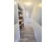 Well-lit hallway with modern flooring and closet space at 623 Chariot Ln, Indianapolis, IN 46227