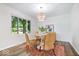 Dining room with wicker chairs, a round table, and a contemporary chandelier at 6337 Cardinal Ln, Indianapolis, IN 46220