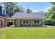 Charming brick home featuring a well-maintained lawn, lovely cupola, and complementary green shutters at 6337 Cardinal Ln, Indianapolis, IN 46220