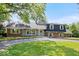 Beautiful property featuring a manicured lawn, mature trees, and a lovely exterior at 6337 Cardinal Ln, Indianapolis, IN 46220