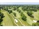 Picturesque aerial view of a lush green golf course with manicured fairways, sand traps and mature trees at 6337 Cardinal Ln, Indianapolis, IN 46220