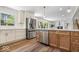 Open-concept kitchen featuring stainless steel appliances and an island with a sink at 6337 Cardinal Ln, Indianapolis, IN 46220