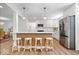 Modern kitchen featuring a center island with seating and stainless steel appliances at 6337 Cardinal Ln, Indianapolis, IN 46220