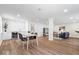Open living space features modern finishes, a bar area, and sleek flooring for a seamless design at 6337 Cardinal Ln, Indianapolis, IN 46220