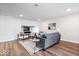Cozy living room with contemporary furnishings, stylish rug, and updated floors at 6337 Cardinal Ln, Indianapolis, IN 46220