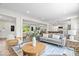Open-concept living room boasts hardwood floors, a modern sofa, and plenty of natural light at 6337 Cardinal Ln, Indianapolis, IN 46220