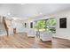 Spacious living area with hardwood floors, large windows, and neutral color palette at 6337 Cardinal Ln, Indianapolis, IN 46220