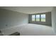 A bright living room features large window overlooking the lawn at 6367 Stone Side Dr, Plainfield, IN 46168