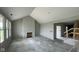 A spacious living room with cathedral ceiling, ample natural light, and fireplace at 6367 Stone Side Dr, Plainfield, IN 46168