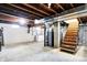Basement with exposed beams, stairs, washer and dryer, and unfinished flooring at 6616 S Cross St, Pendleton, IN 46064